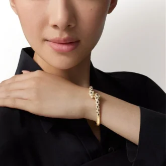 Bransoletka Panthere De Cartier, mały model, częściowo wysadzana kamieniami