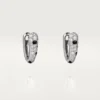 Małe kolczyki w kształcie kółek Panthere Diamond, białe złoto | Cartier Us