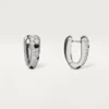 Małe kolczyki w kształcie kółek Panthere Diamond, białe złoto | Cartier Us