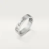 Obrączka ślubna C De Cartier – platyna, diamenty – Cartier