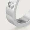 Obrączka ślubna C De Cartier – platyna, diamenty – Cartier