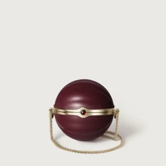 Okrągła torebka z motywem gadroon, Cartier Soir