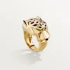 Pierścionek Panthere De Cartier – żółte złoto, lakier, granat tsaworytowy, onyks – Cartier