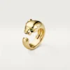 Pierścionek Panthere De Cartier – żółte złoto, onyks, granat tsaworytowy – Cartier