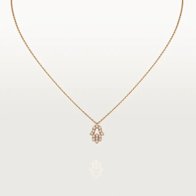 Wisiorek z sercami i symbolami – różowe złoto, diamenty – Cartier
