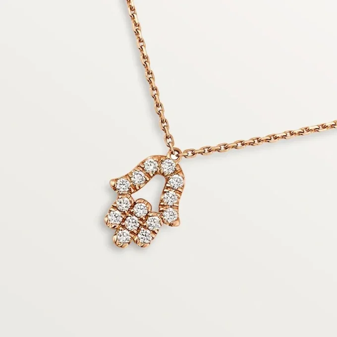 Wisiorek z sercami i symbolami – różowe złoto, diamenty – Cartier