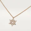 Wisiorek z sercami i symbolami – różowe złoto, diamenty – Cartier